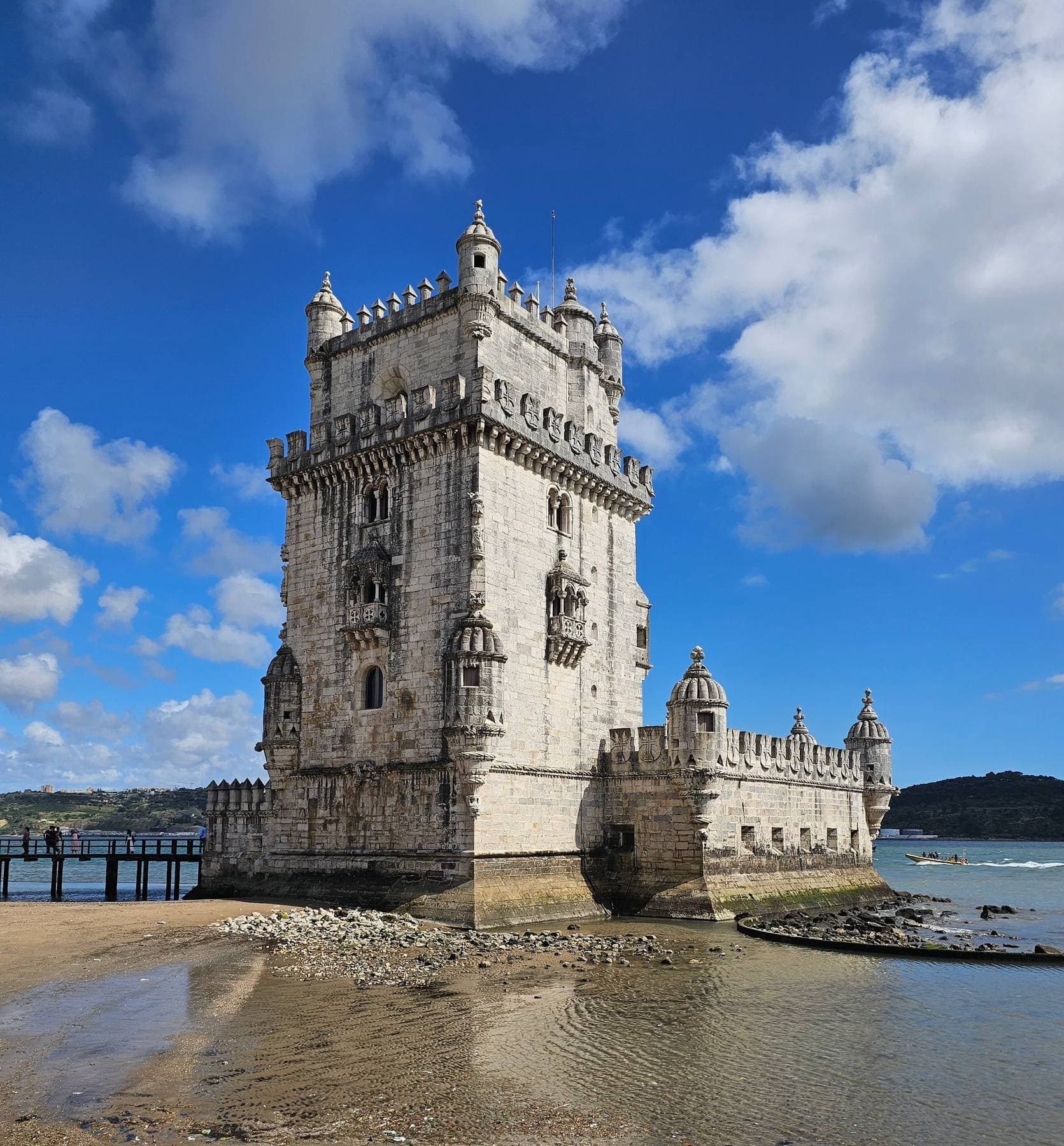 The Manueline tower and bastion of Belém Tower against a blue sky