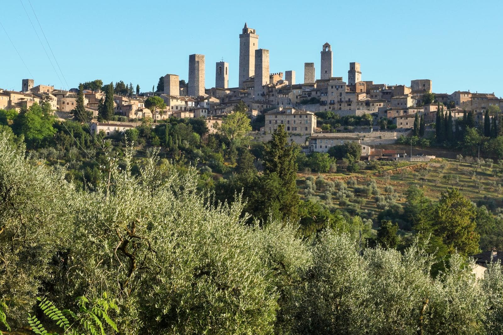 Medieval towers of San Gimignano above the Tuscan countryside
