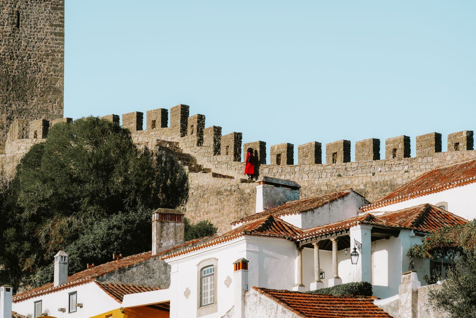 Whitewashed houses below the medieval walls of Óbidos