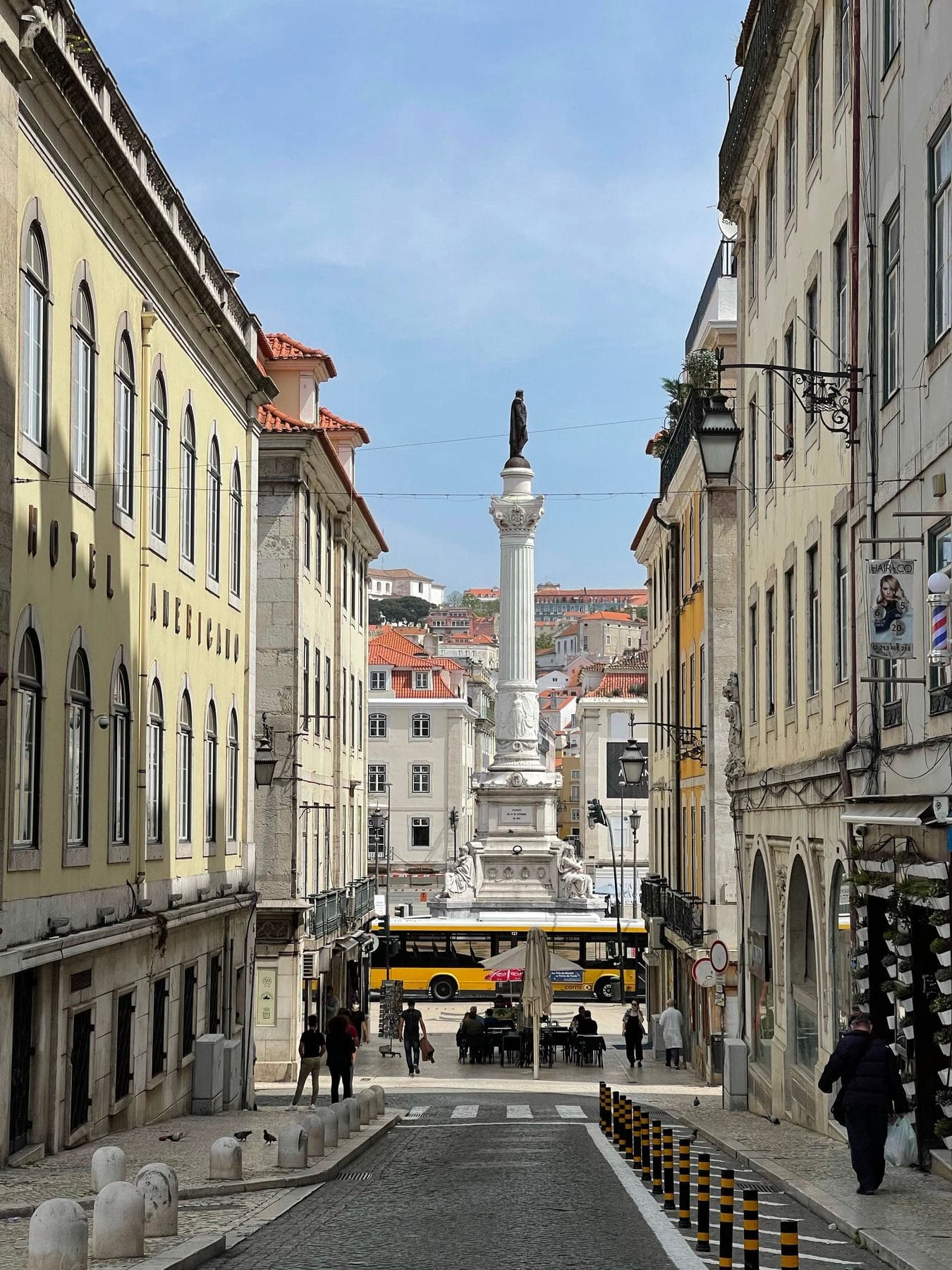 A monument column at the end of a street in Lisbon's Baixa