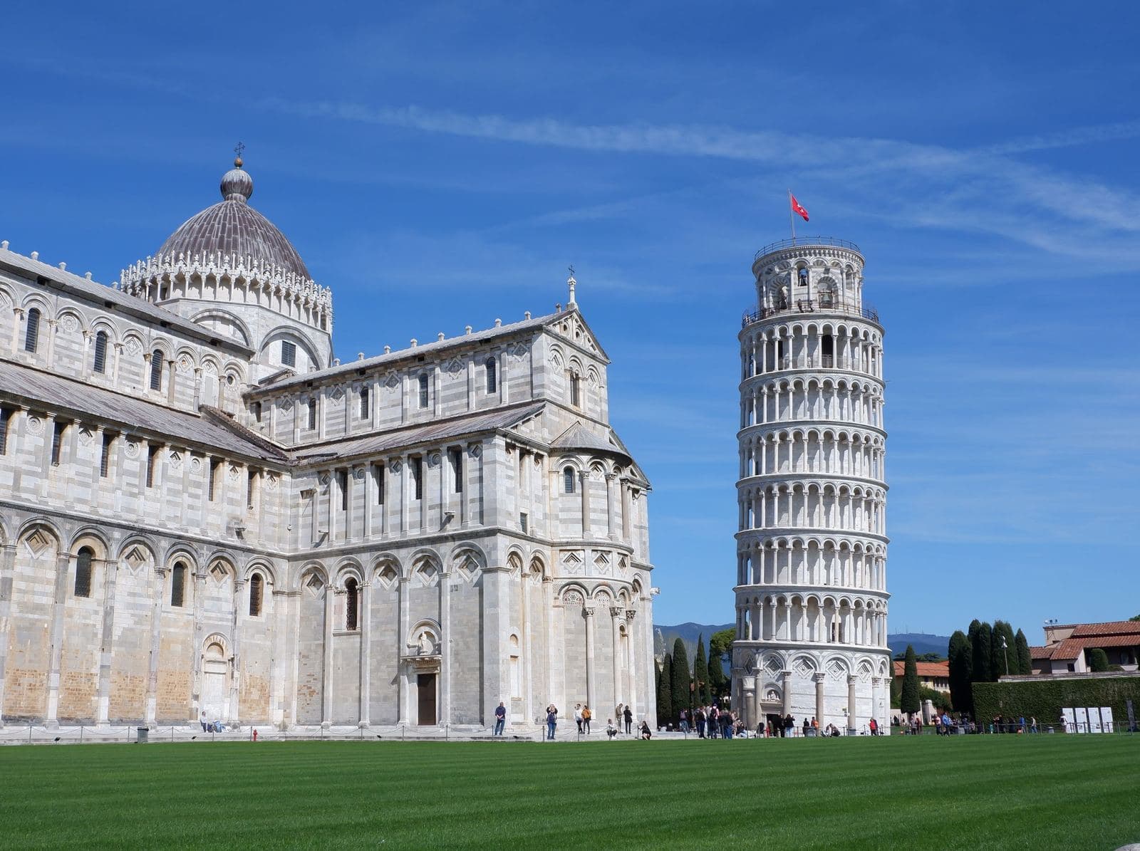 Leaning Tower of Pisa and the cathedral under a blue sky