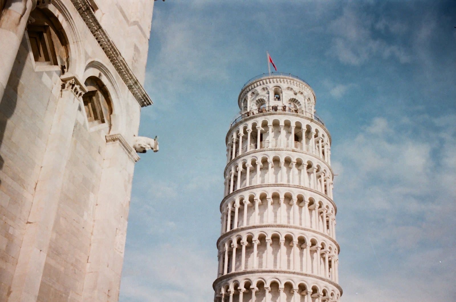 The Leaning Tower of Pisa from below, against a blue sky