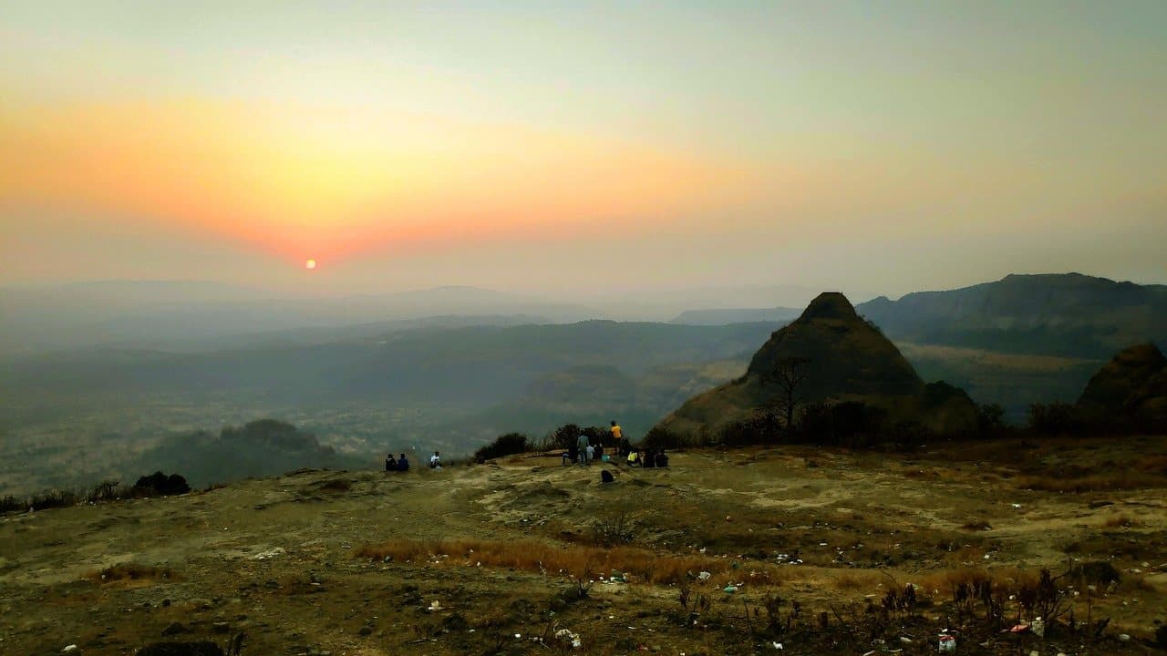 The sun low over the hills around Pune
