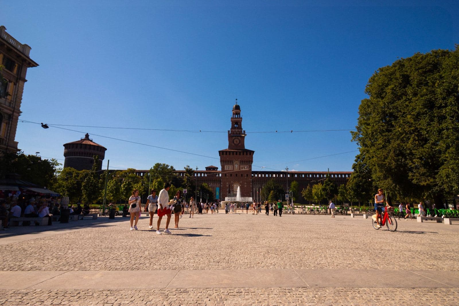Sforza Castle seen across Piazza Castello on a sunny day
