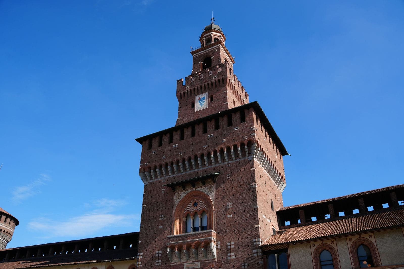 Tower of Sforza Castle against a clear blue sky
