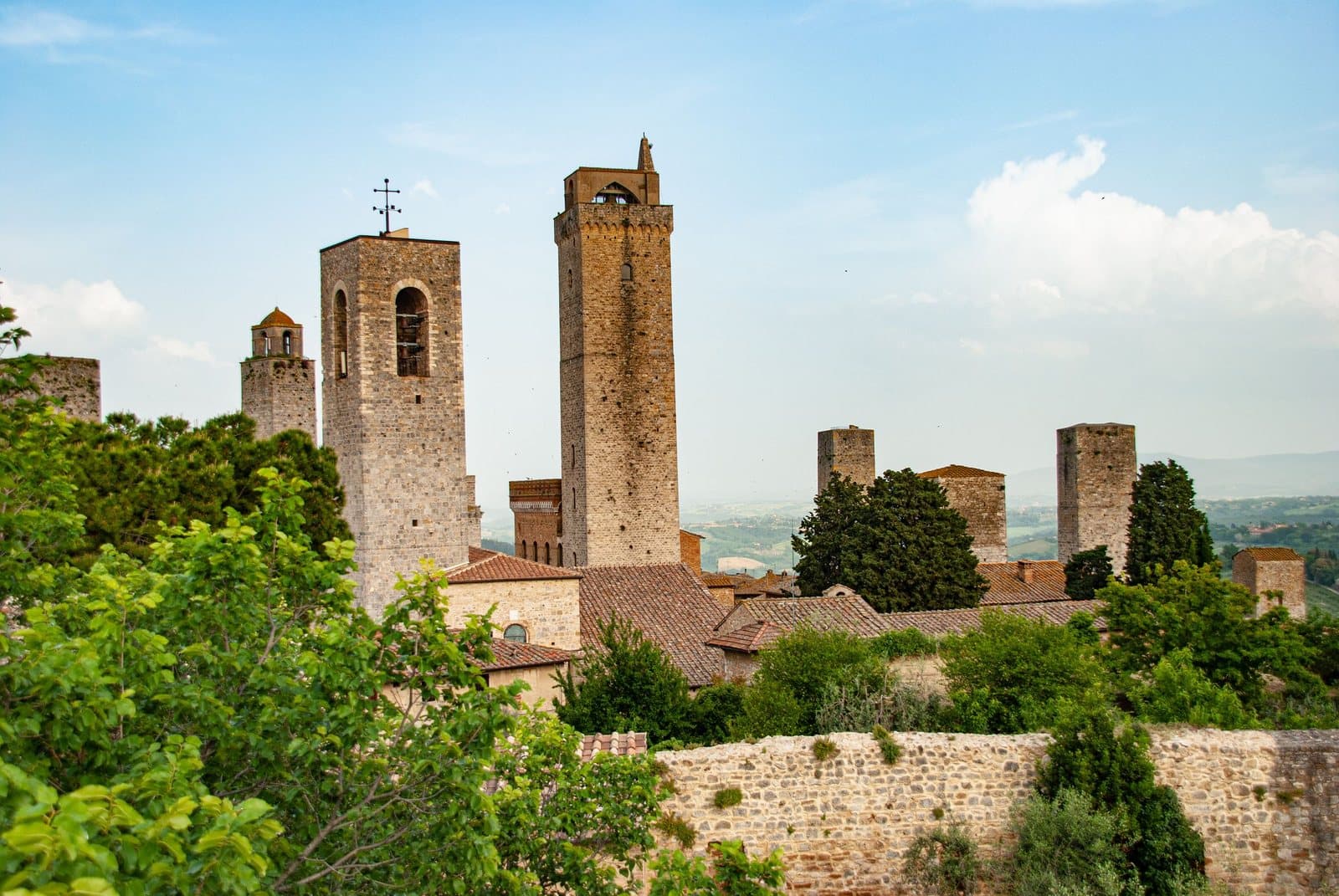 Medieval towers of San Gimignano above the trees