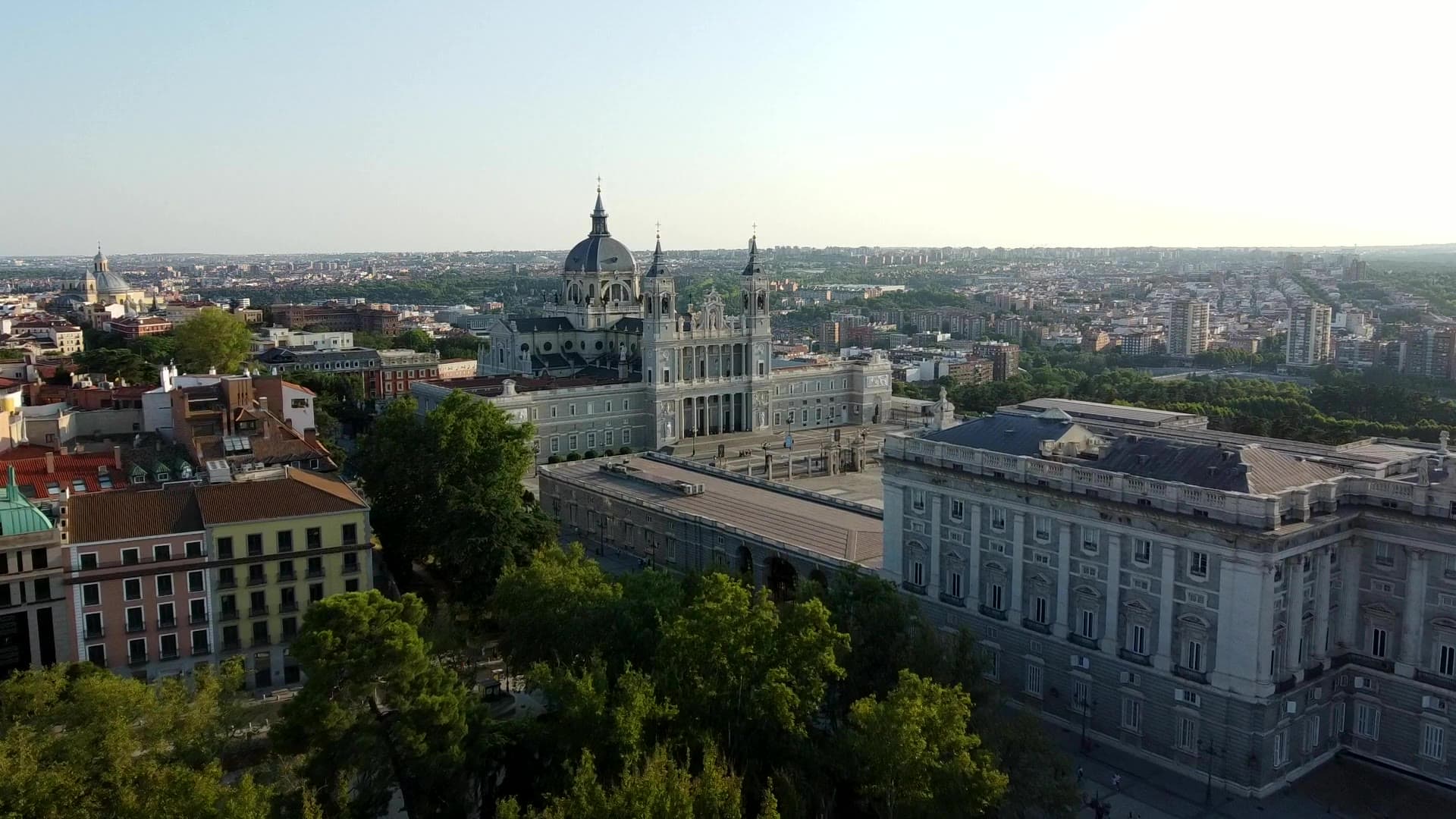 The Royal Palace of Madrid and Almudena Cathedral from the air on a summer evening