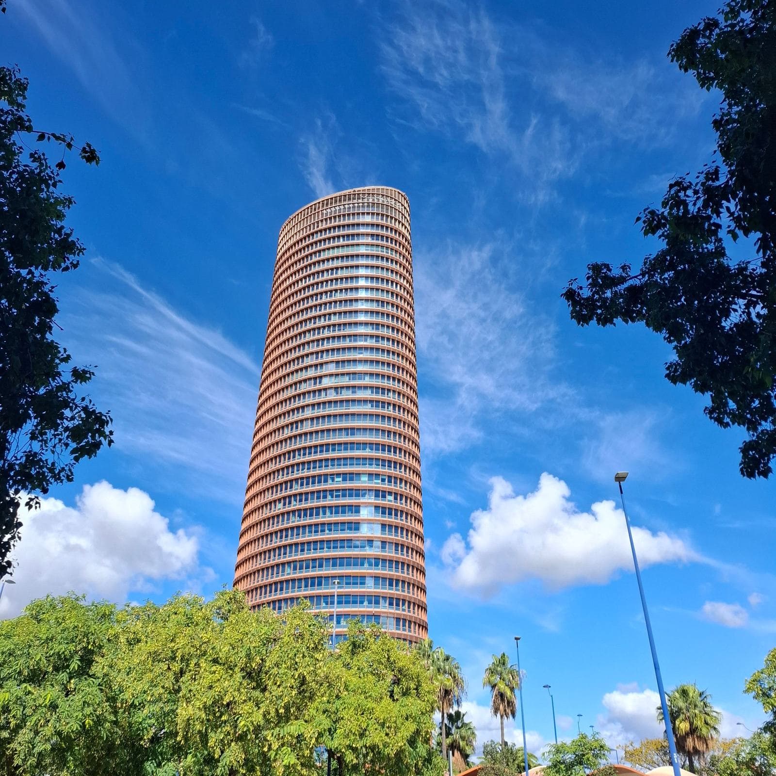 Torre Sevilla rising against a blue sky