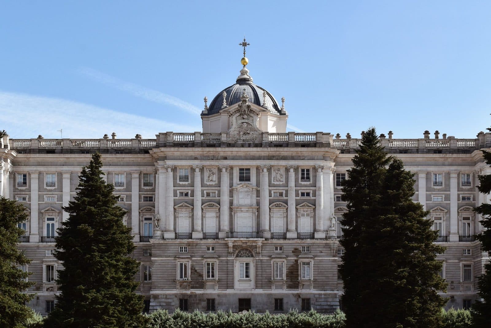 East façade of the Royal Palace of Madrid seen from the Plaza de Oriente gardens