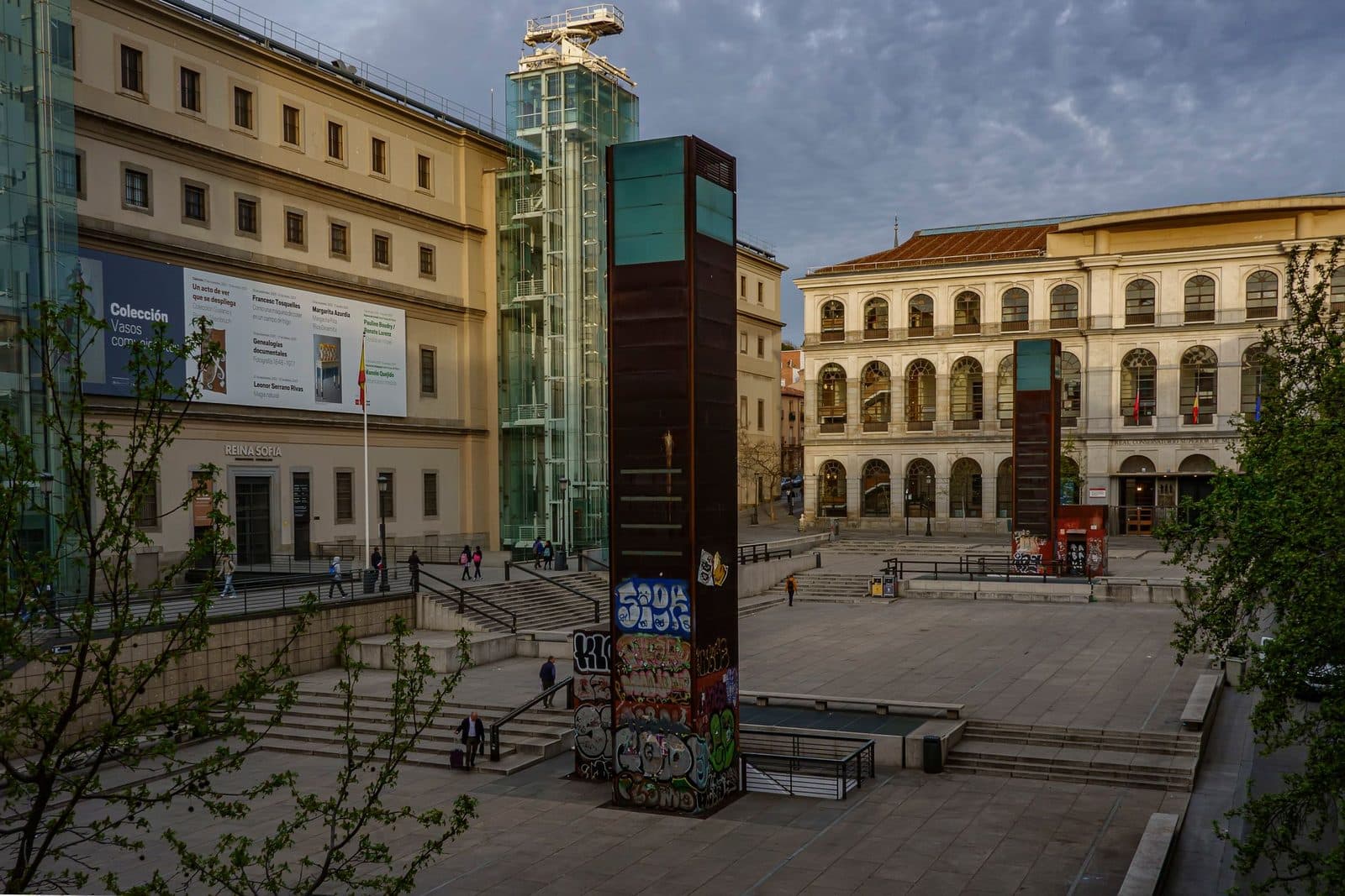 Entrance square of the Reina Sofía Museum with its glass lift towers