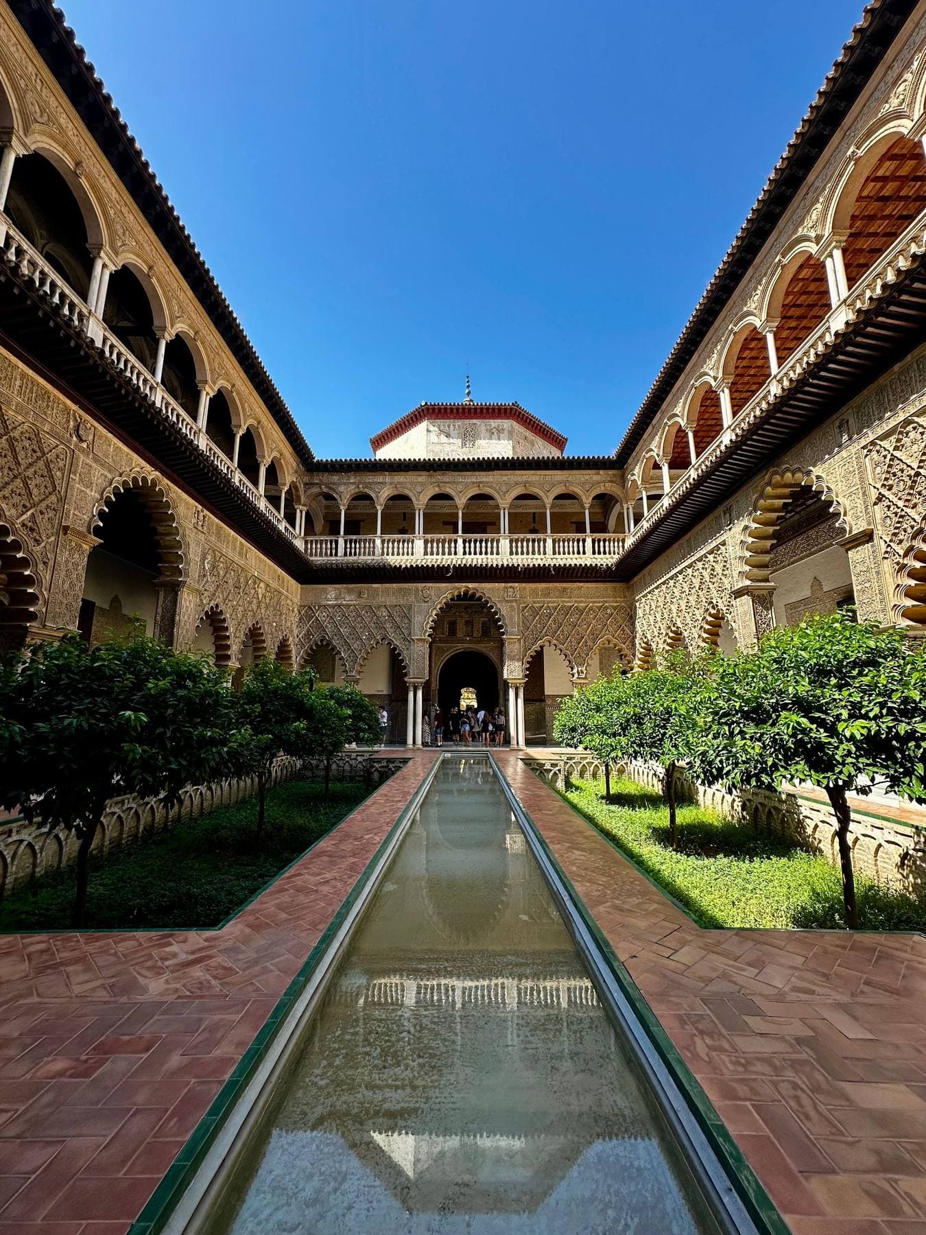 The Patio de las Doncellas in the Royal Alcázar, with its long pool and arcades